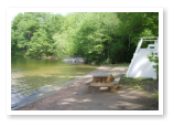 One of the many beaches you can access on Duncan Lake from our campground.